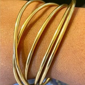 Gold Tone 5 Interlocking Bangle Set. 8 3/4 inches